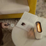 Small portable heater next to an open book on a table