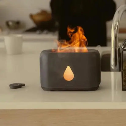Modern fire pit with flames on a kitchen counter