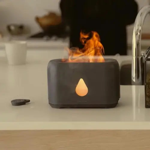 Modern fire pit with flames on a kitchen counter